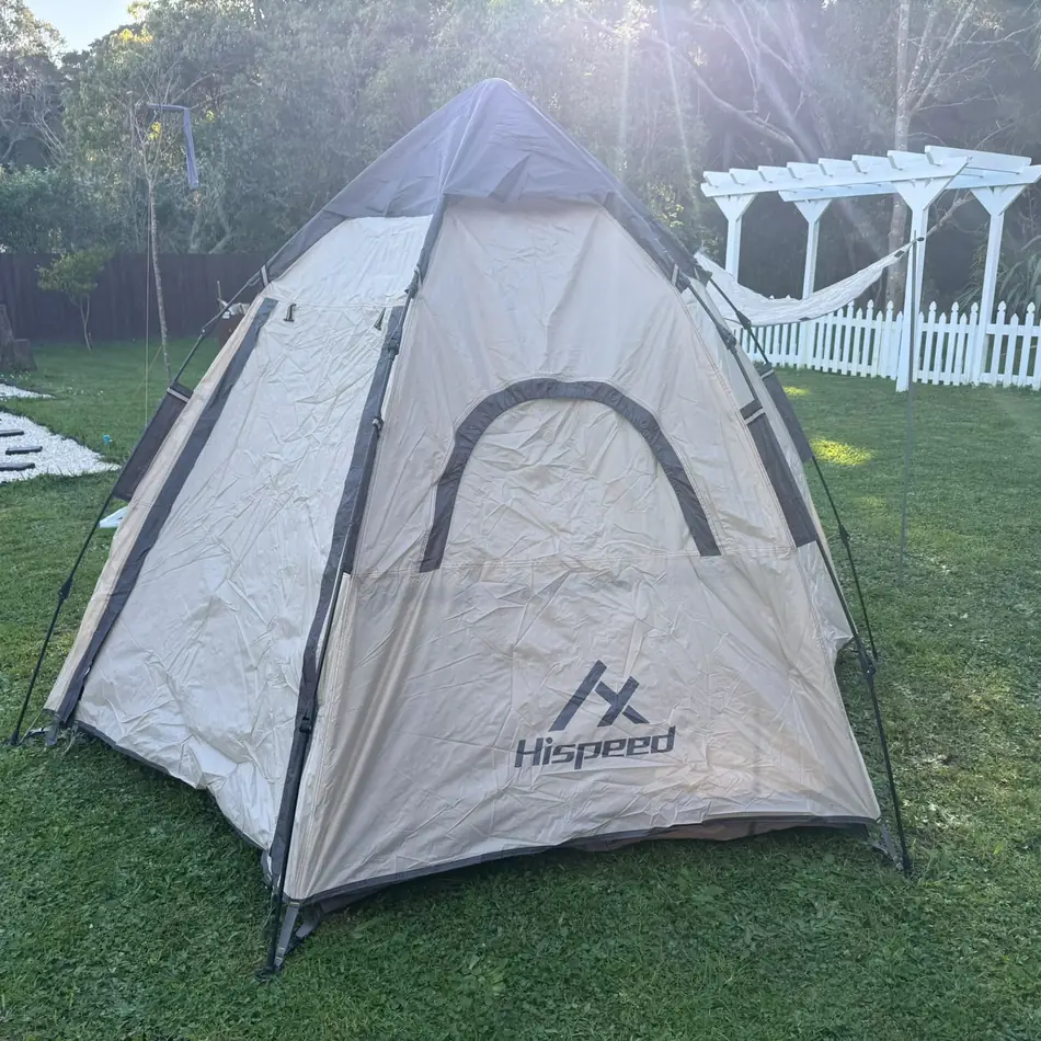 Double-Layer Hexagon Tent in Cream, set up in an Auckland backyard