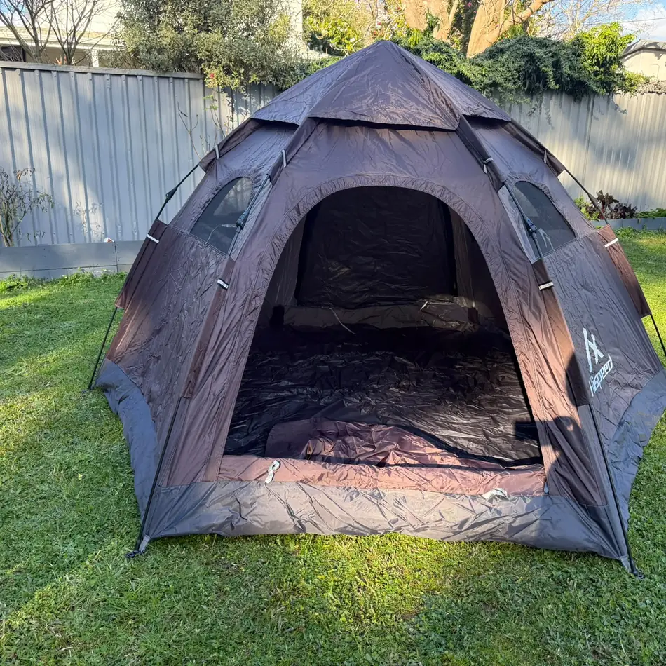 Quick-Pitch Hexagon Tent set up in an Auckland backyard